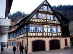 Gertrud, Eugen, and Elfriede walking outside the town wall in the Gerberviertel, the tanner's quarters, past the town's second mill, the �u�ere M�hle, and it is the oldest half-timbered house in Schiltach, built in 1557.